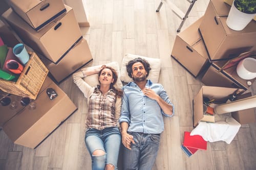 A couple moving out of their house representing rv travel trends 2026